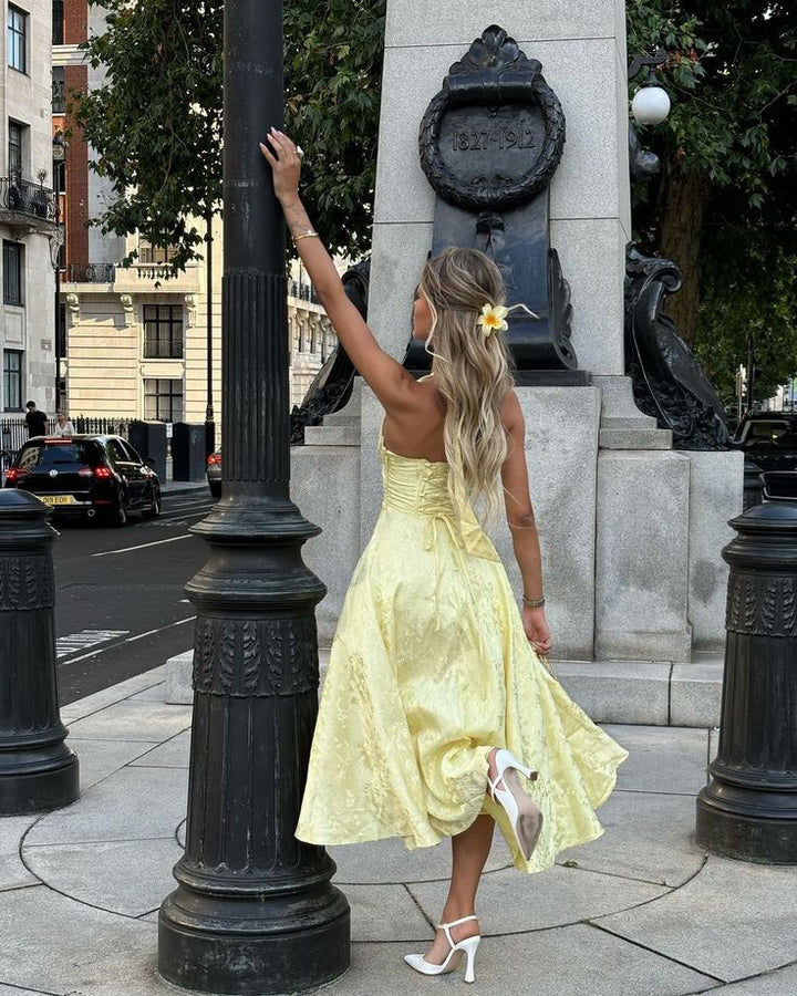 Versatile women's elegant midi dress; corset halter design, A-line silhouette, suitable for weddings & parties.