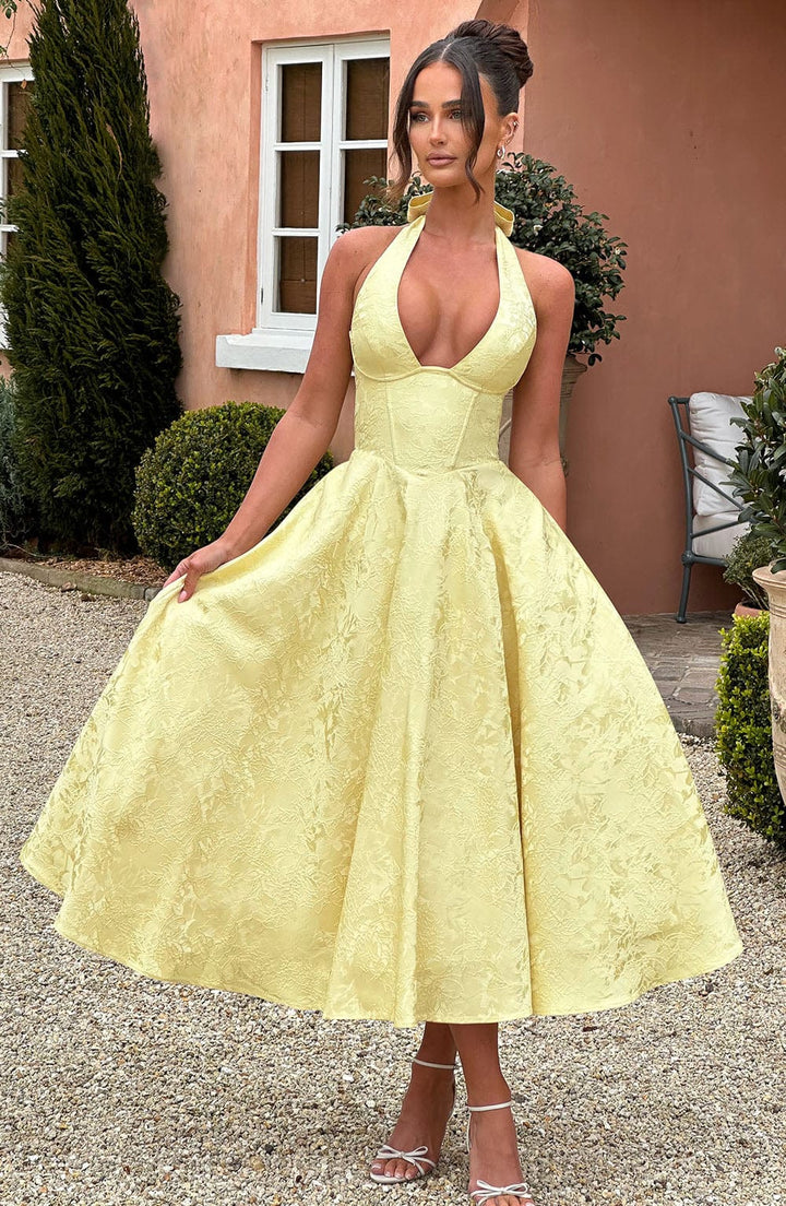 Fashionable women's A-line midi dress with a chic corset halter top, an elegant choice for any formal occasion.