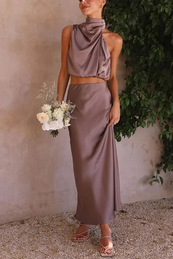 Sophisticated women's elegant halter neck crop top and matching maxi skirt. Ideal evening ensemble.