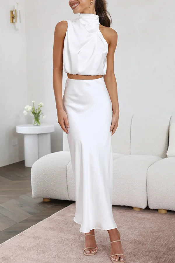 Stunning women's two-piece set: elegant halter neck crop top paired with a sophisticated maxi skirt.