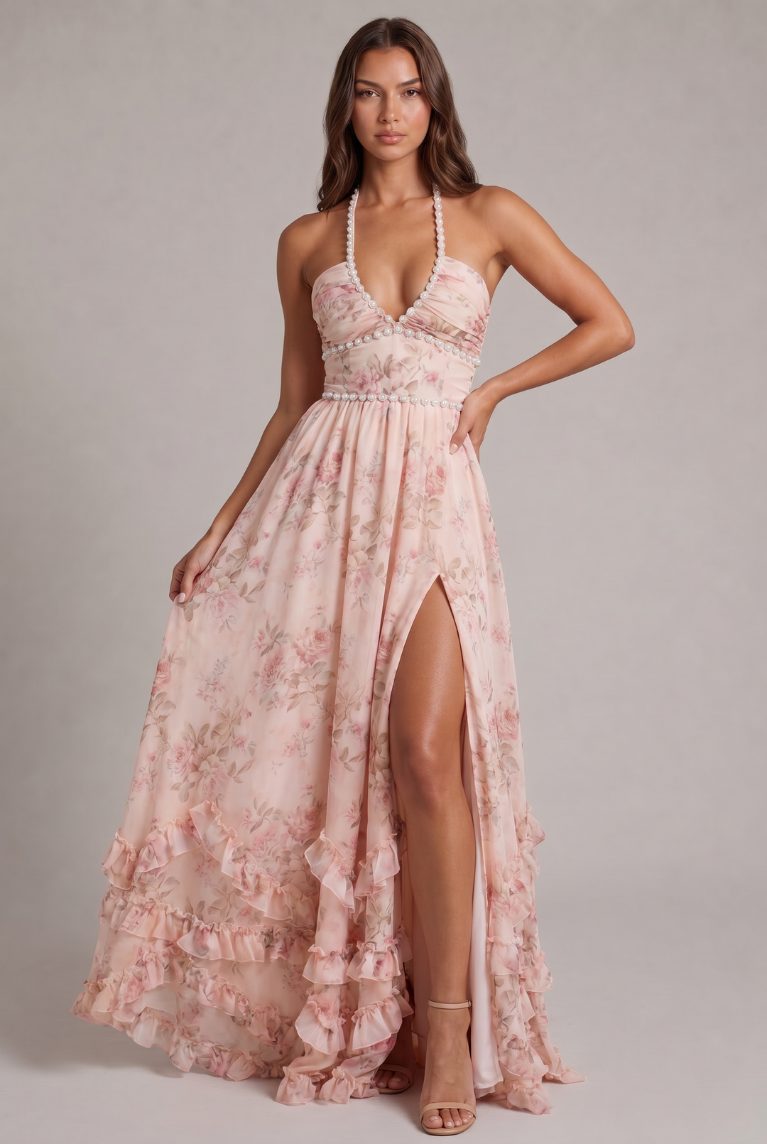 Elegant women's halter neck floral maxi dress, flowy pleated skirt, perfect for summer occasions.