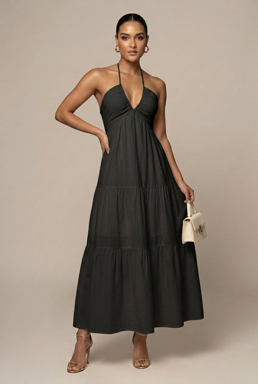 Stylish women's halter neck beach chic maxi dress with tiered ruffles and a comfortable tie waist.