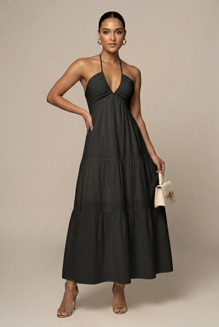 Stylish women's halter neck beach chic maxi dress with tiered ruffles and a comfortable tie waist.