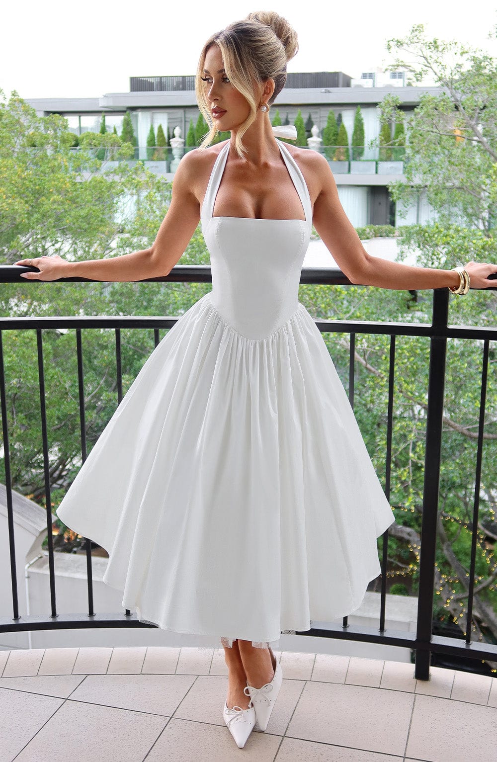 Elegant women's halter neck midi cocktail dress with A-line flared skirt.