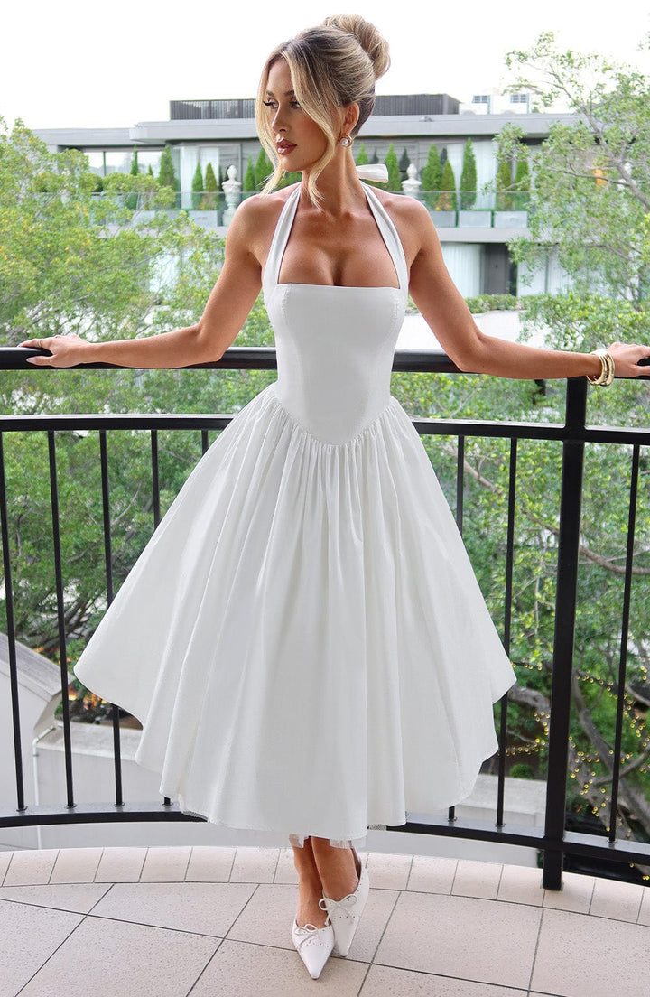 Elegant women's halter neck midi cocktail dress with A-line flared skirt.