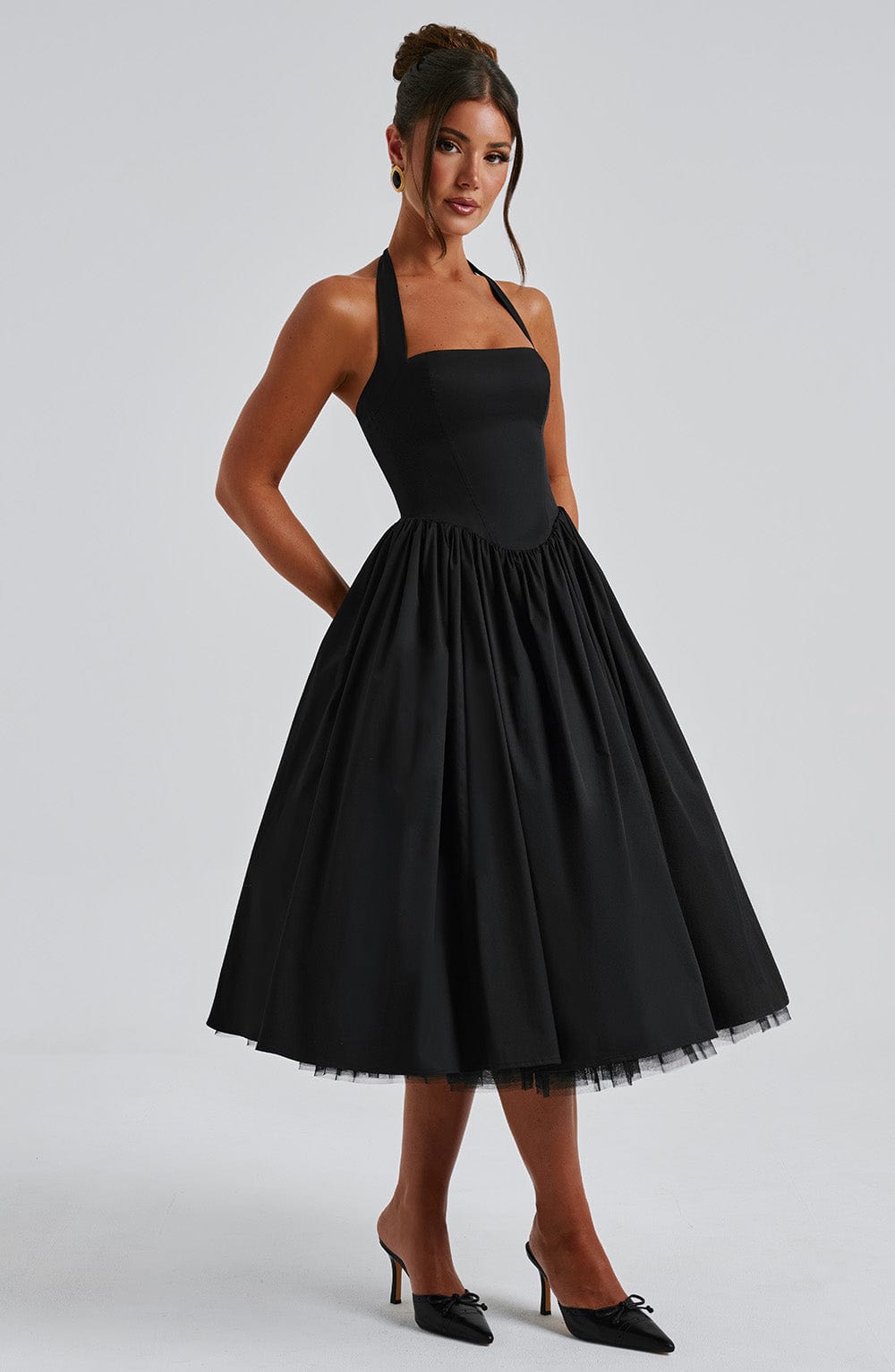 Sophisticated women's wedding guest dress, elegant halter midi style.