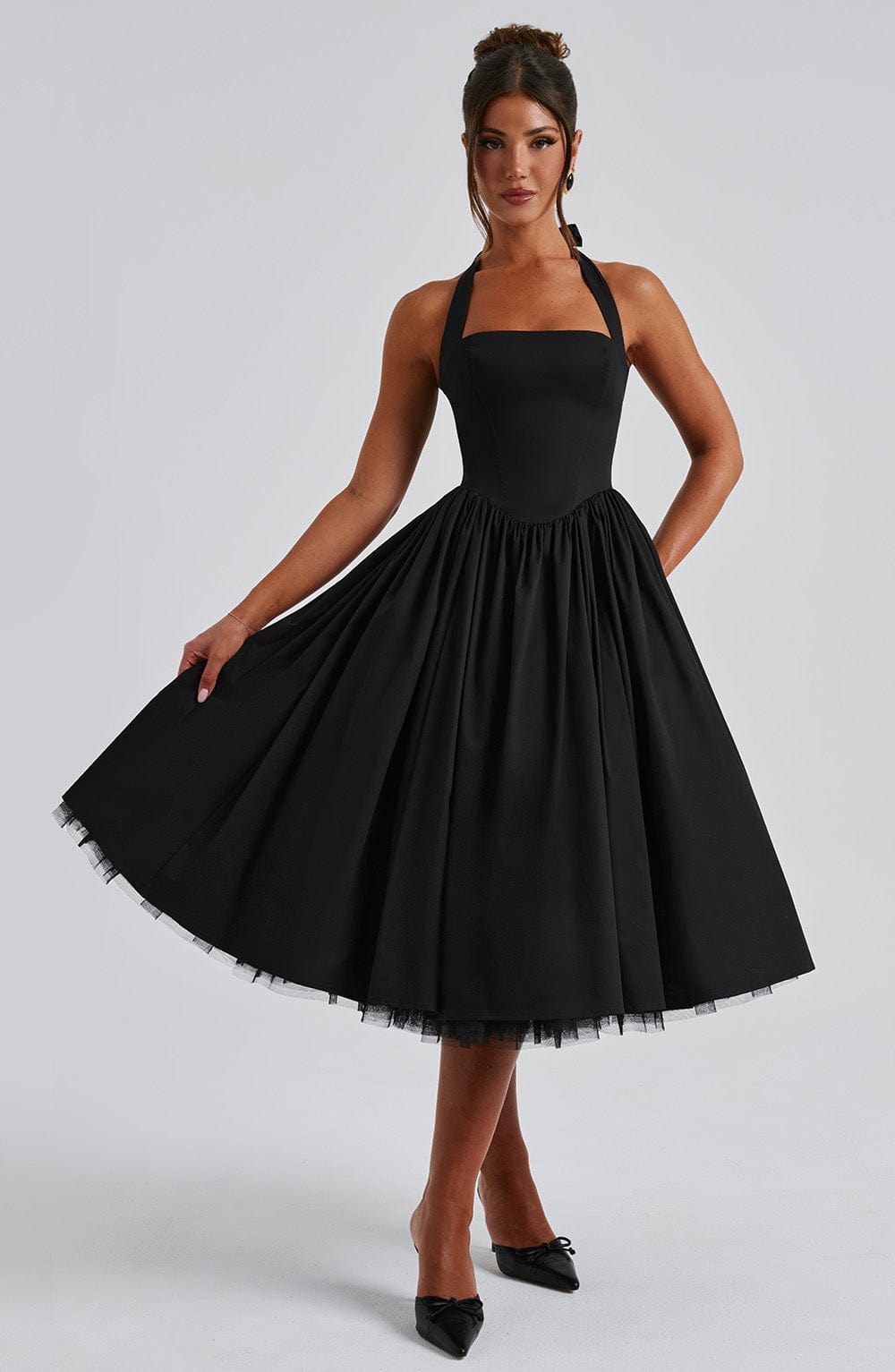 Elegant women's special occasion dress, midi A-line with halter neck.