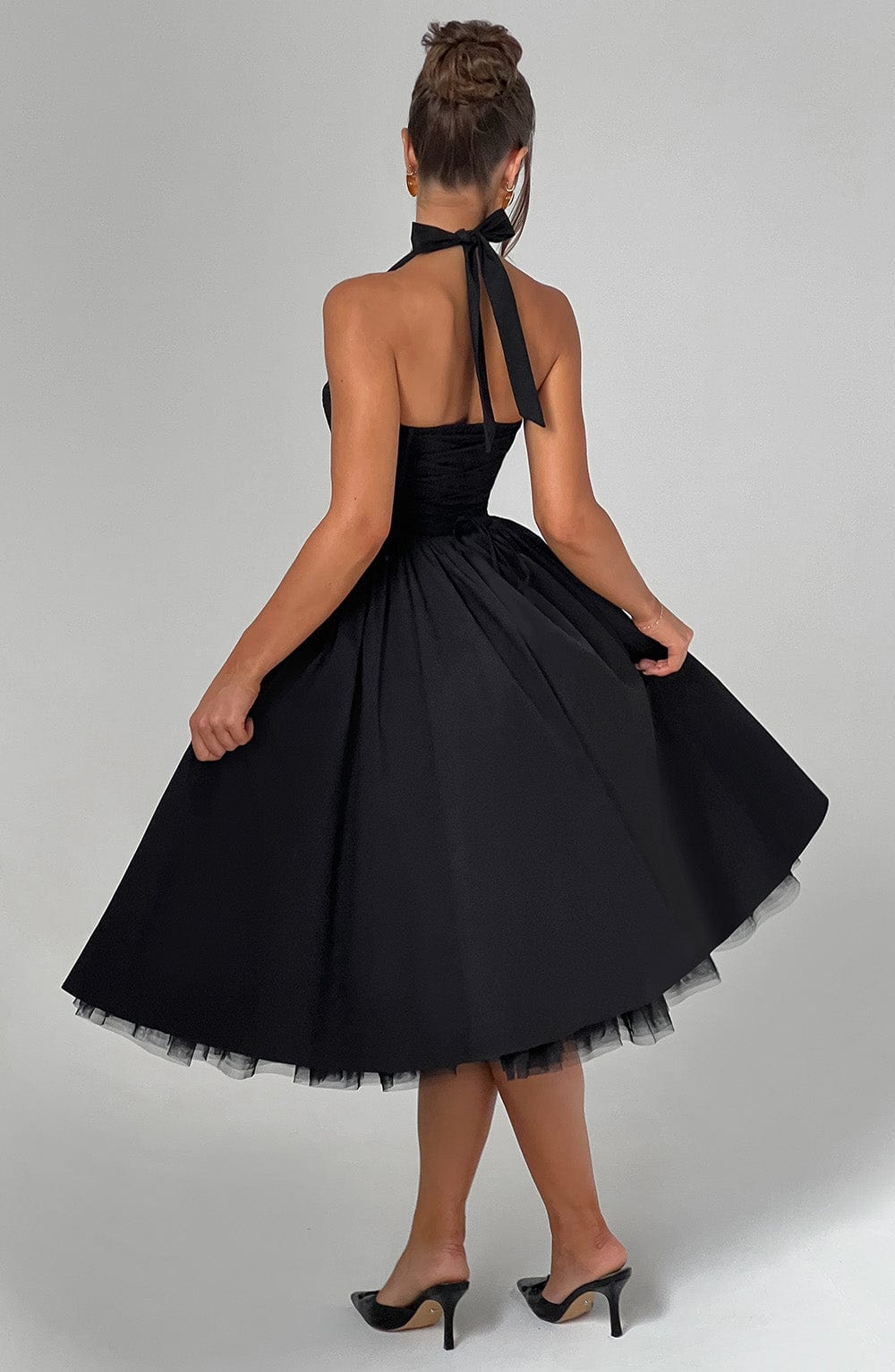 Women's formal party midi dress, elegant A-line silhouette and halter neck.