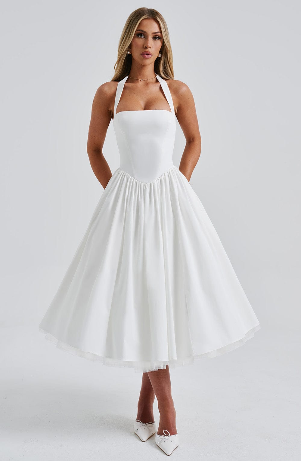 Stylish A-line midi dress for women, features a flattering halter neck design.