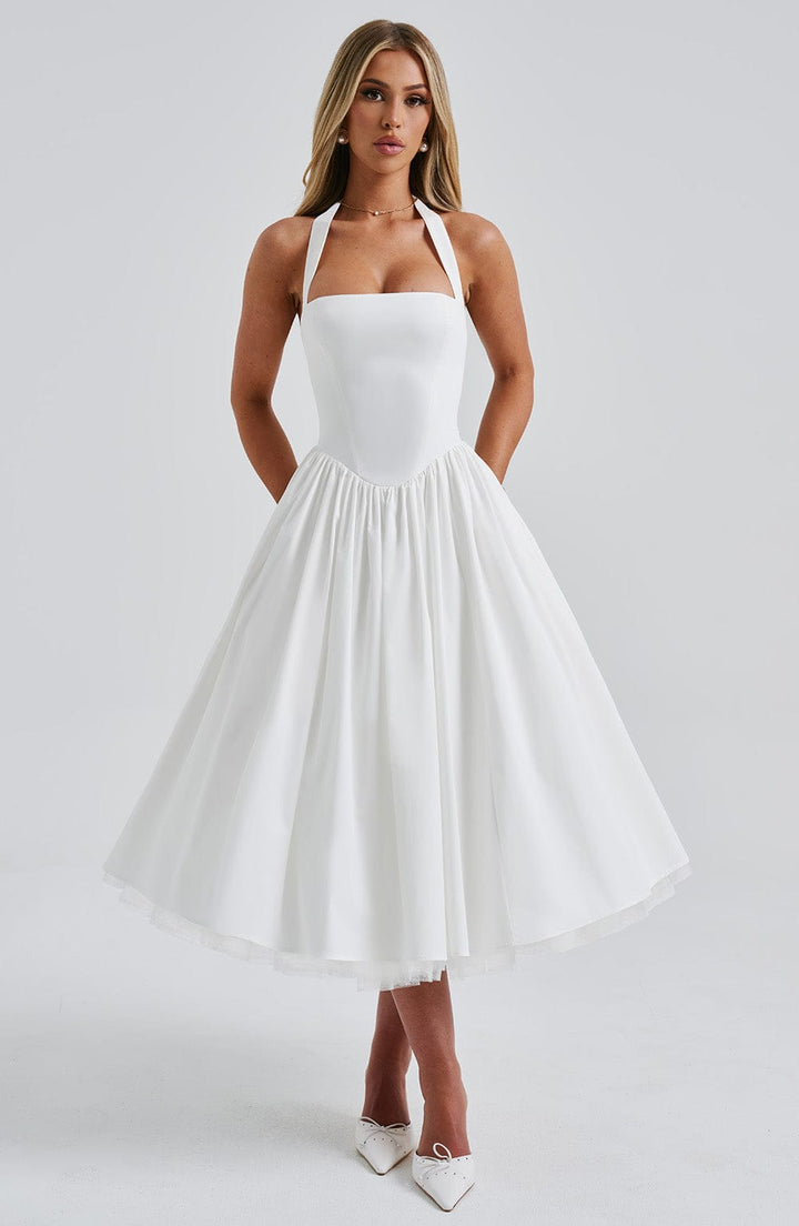 Stylish A-line midi dress for women, features a flattering halter neck design.
