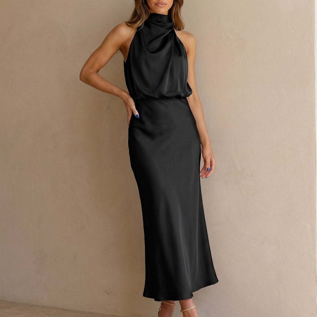 Stylish women's halter neck midi dress featuring a draped blouson waist, ideal for cocktail parties.