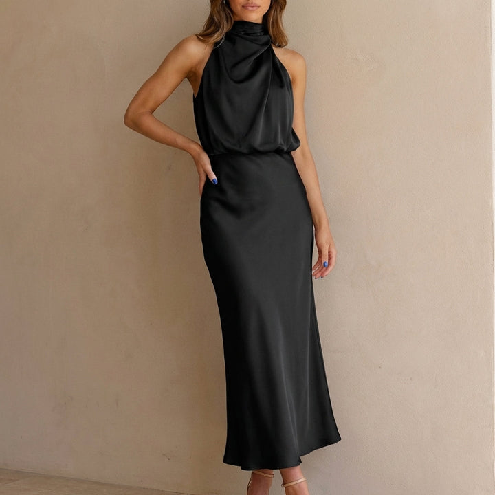 Stylish women's halter neck midi dress featuring a draped blouson waist, ideal for cocktail parties.