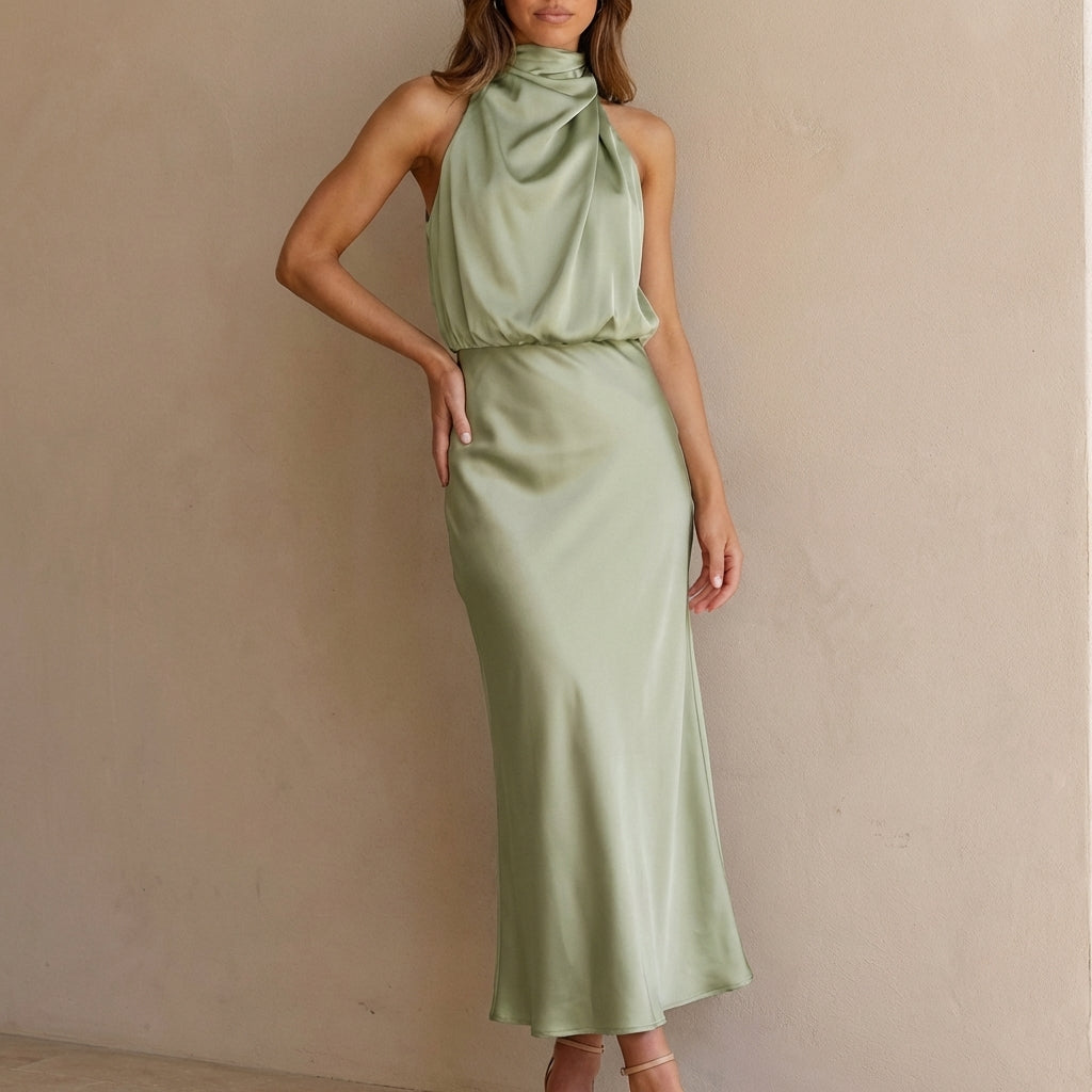 Chic women's party dress: halter neck, midi length, elegant draped blouson waist. Ideal for events.