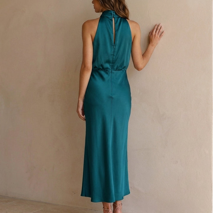 Elegant women's special occasion dress: halter neck midi with draped blouson waist. Sophisticated style.