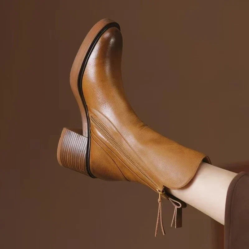 Elegant women's high heel ankle boots with a convenient zipper, perfect for evening wear.