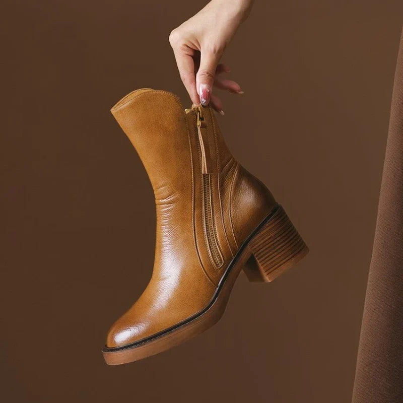 Chic women's high-heel ankle boots featuring a sleek zipper closure for easy wear & comfort.