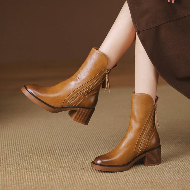 Fashionable women's dress boots; high heel ankle style with a practical side zipper.