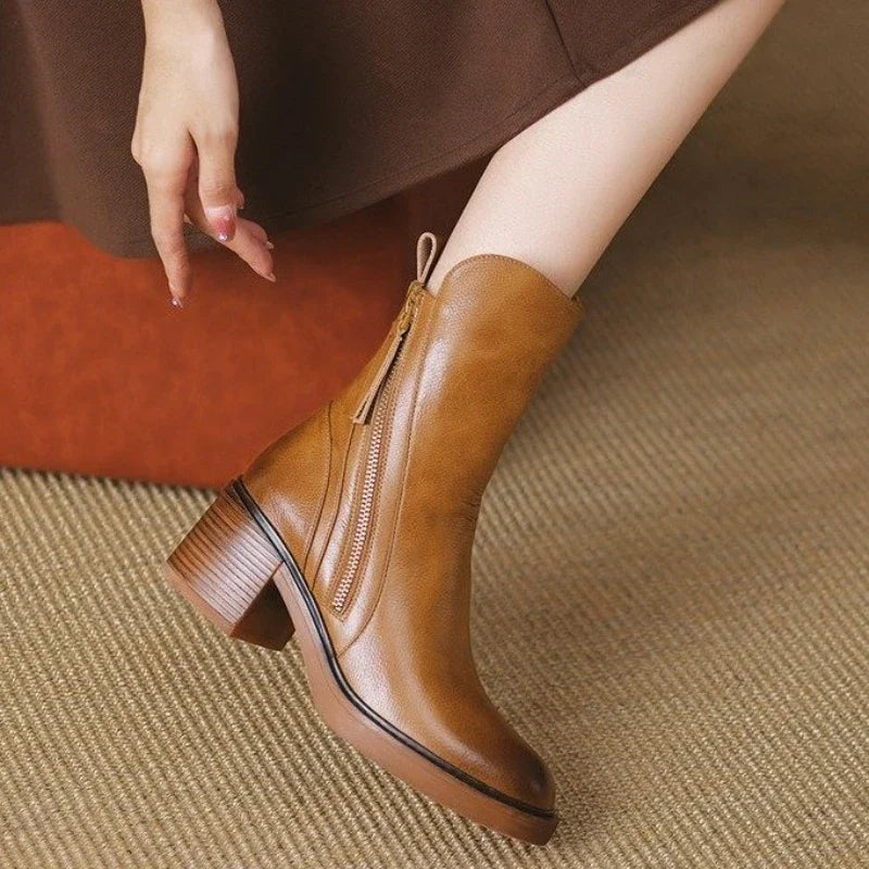 Stylish women's ankle boots with a high heel and functional zipper, ultimate elegant footwear.