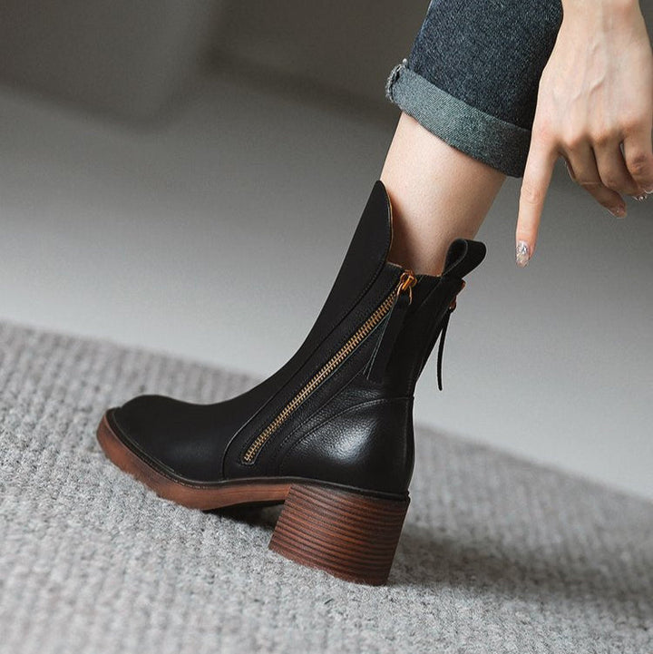 Modern women's fashion boots: elegant high heel ankle design with a sleek zipper detail.