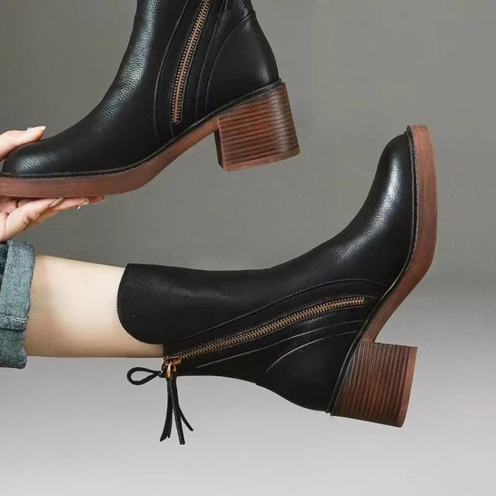 Premium women's elegant high heel ankle boots with zipper, essential chic footwear for any occasion.