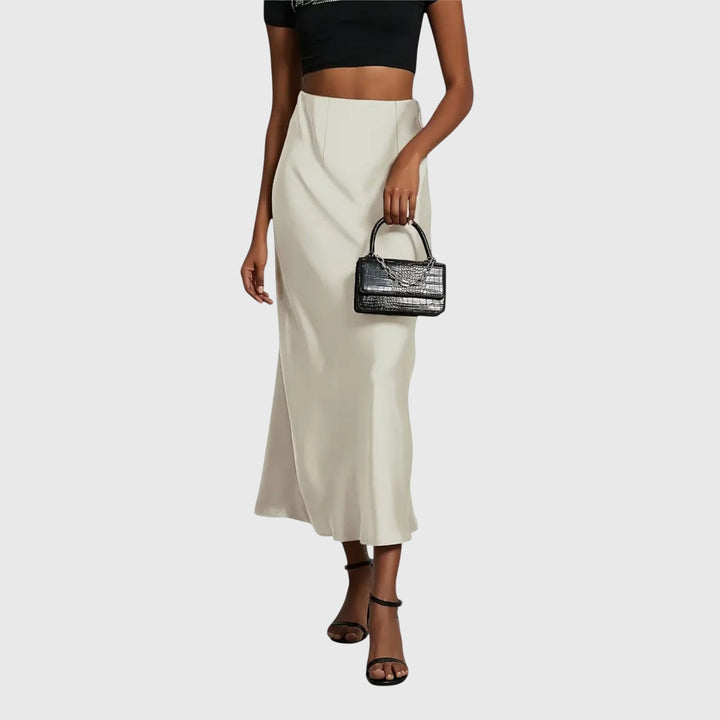 Versatile women's high waist slip maxi skirt. Available in cream, black, and bordeaux for elegant styling.