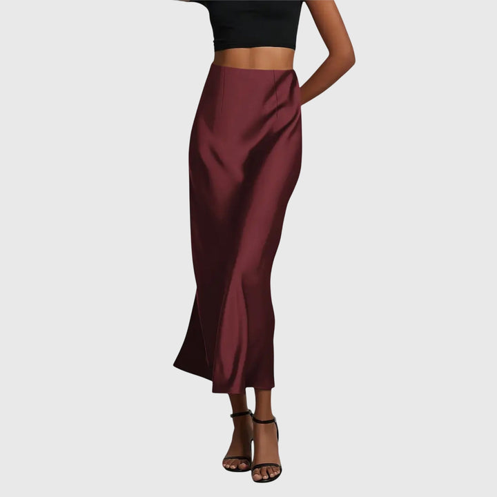 Women's elegant bias cut slip maxi skirt with a high waist, offering versatile style for evening or casual looks.