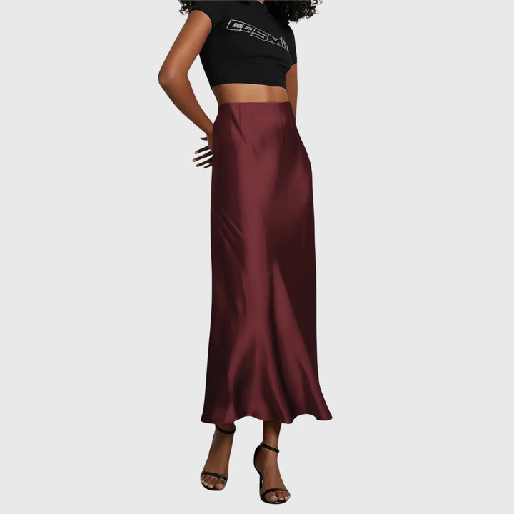 Black women's elegant high waist bias cut maxi slip skirt, perfect for chic evening wear or sophisticated casual.