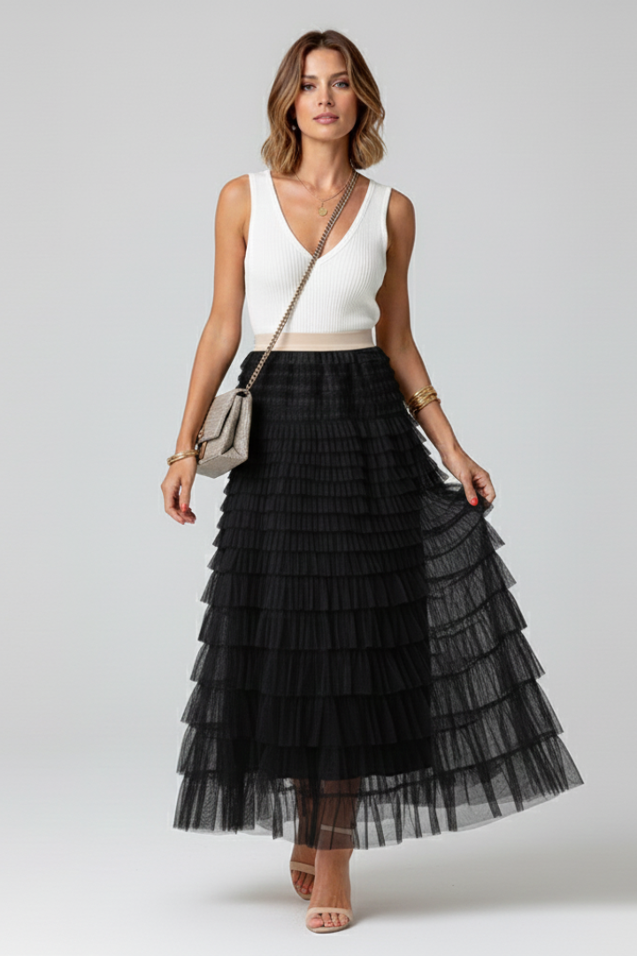 A-line high-waist women's midi skirt with elegant tiered ruffles, offering a romantic and flowy look.