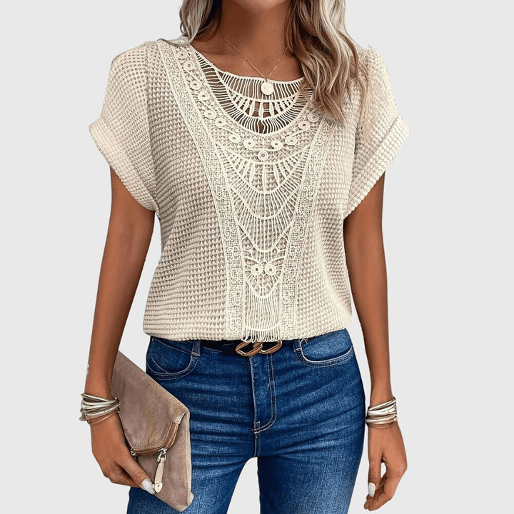 Elegant women's Ibiza style blouse with delicate lace details. Perfect for summer fashion.