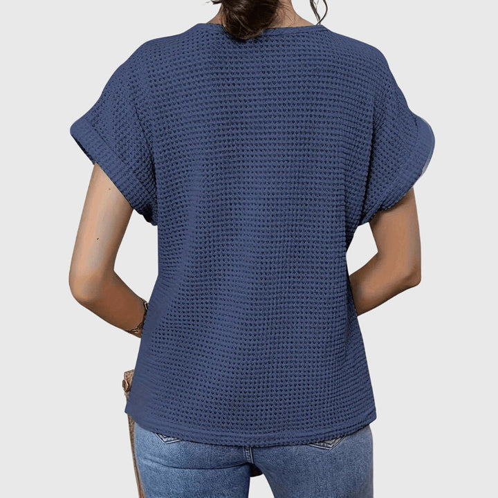Women's elegant Ibiza blouse featuring intricate lace details & a relaxed fit.