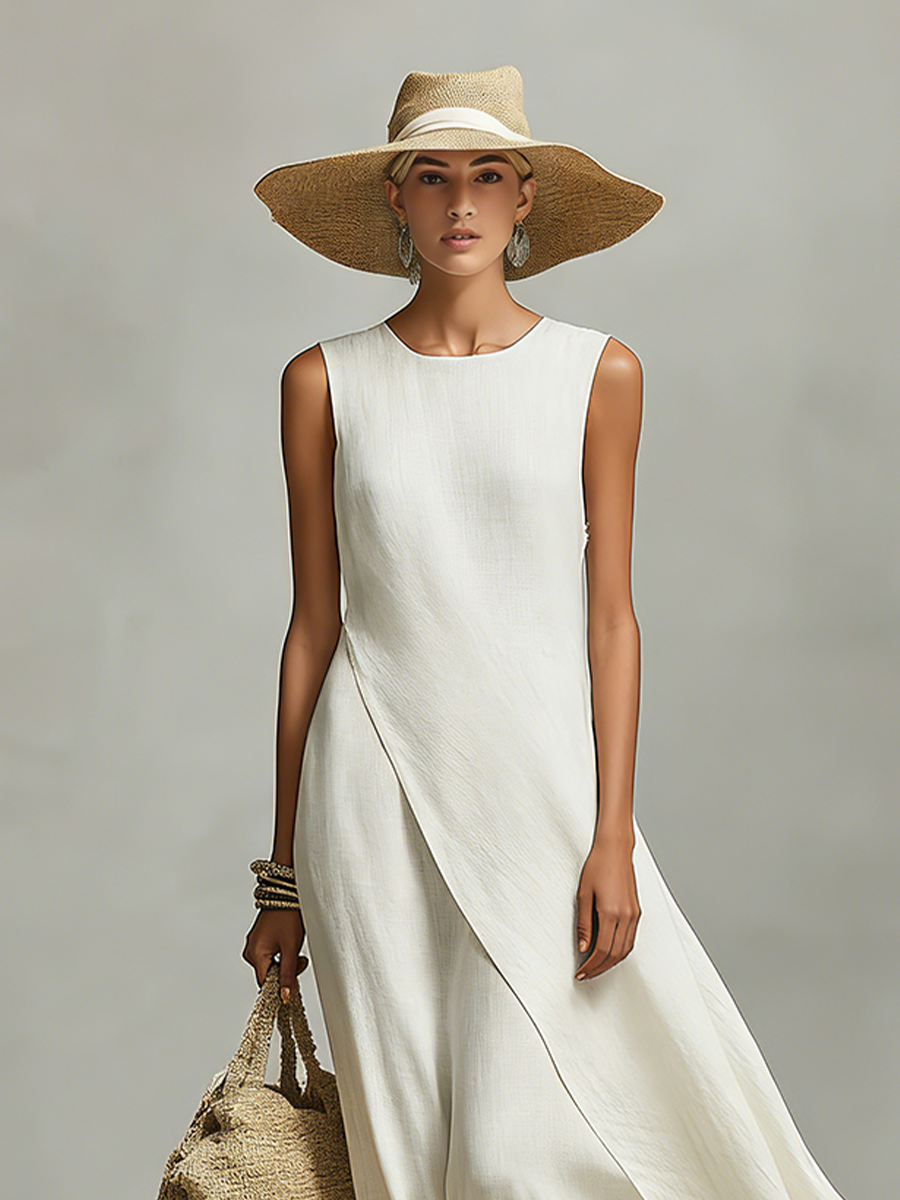 Stylish ivory maxi dress with a unique flowy asymmetric hem, sleeveless design. Great elegant summer wear.