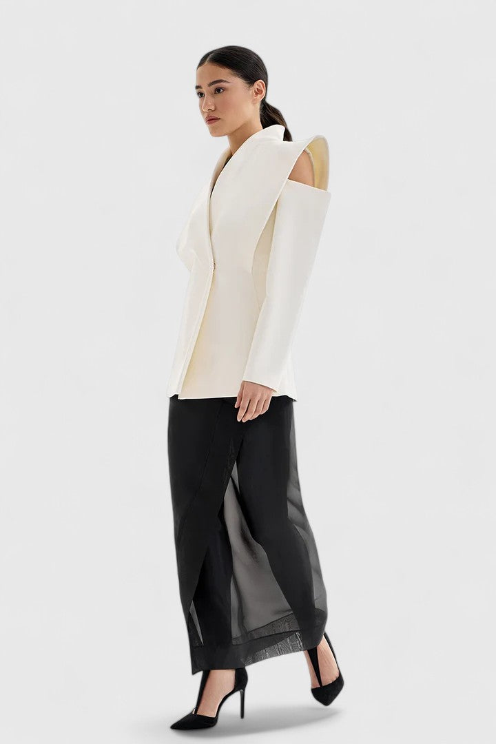 Chic white tailored jacket for women, featuring a sleek design and structured shoulders, ideal for professional attire.
