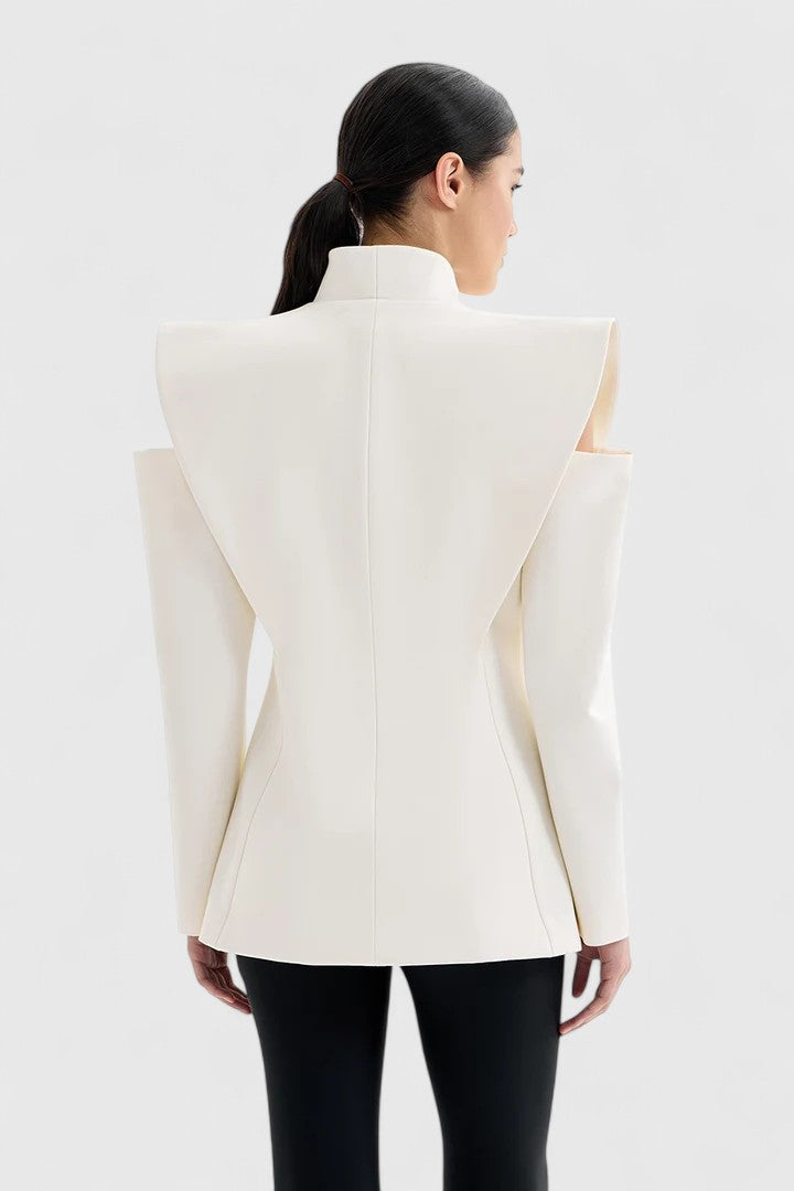 Smooth ivory women's tailored blazer with sharp structured shoulders, exuding professional elegance and modern style.