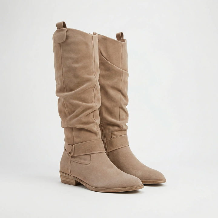 Fashionable women's knee-high boots with elegant silhouette & practical side zipper. Great for any occasion.
