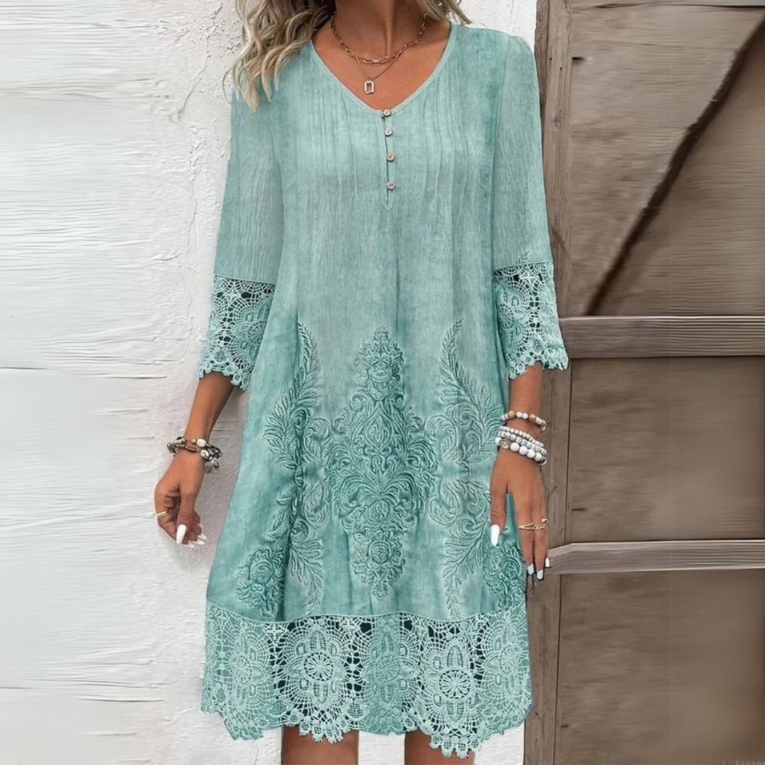 Feminine women's shift midi dress featuring delicate lace details & comfortable three-quarter sleeves, for day wear.