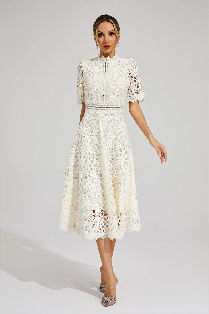 Intricate lace detail on this elegant women's midi dress. Ideal for weddings & formal events.