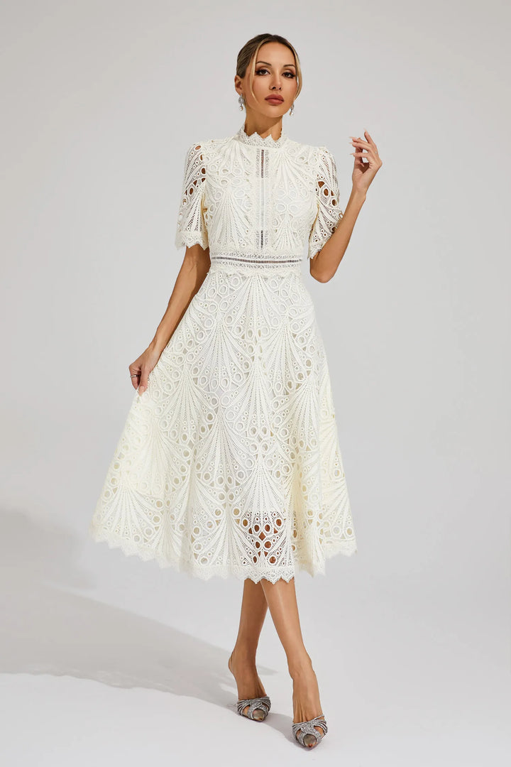 Close-up of exquisite lace on an elegant women's midi dress, perfect for weddings & parties.