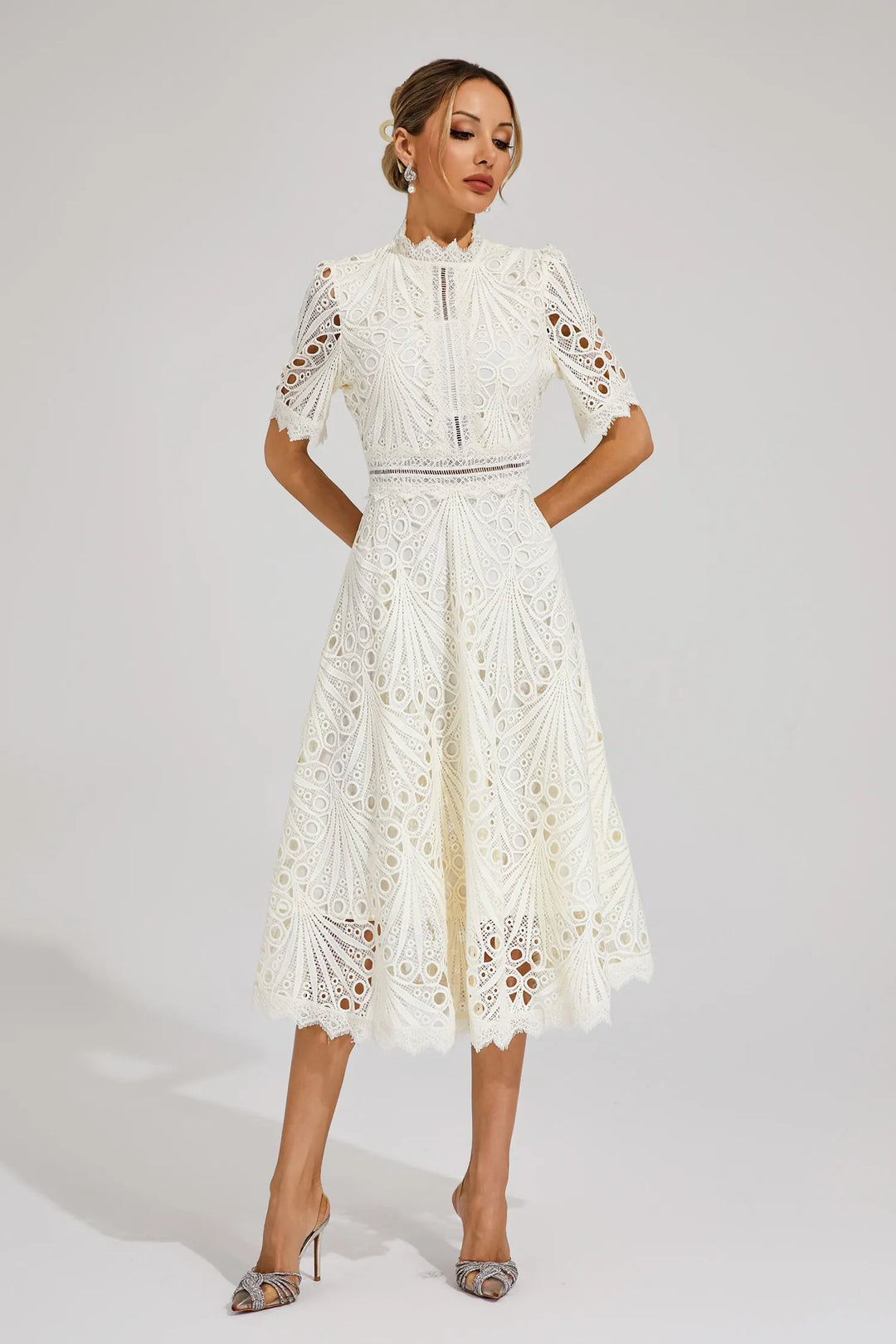 Model in elegant women's lace midi dress. Feminine style for special occasion & wedding guests.