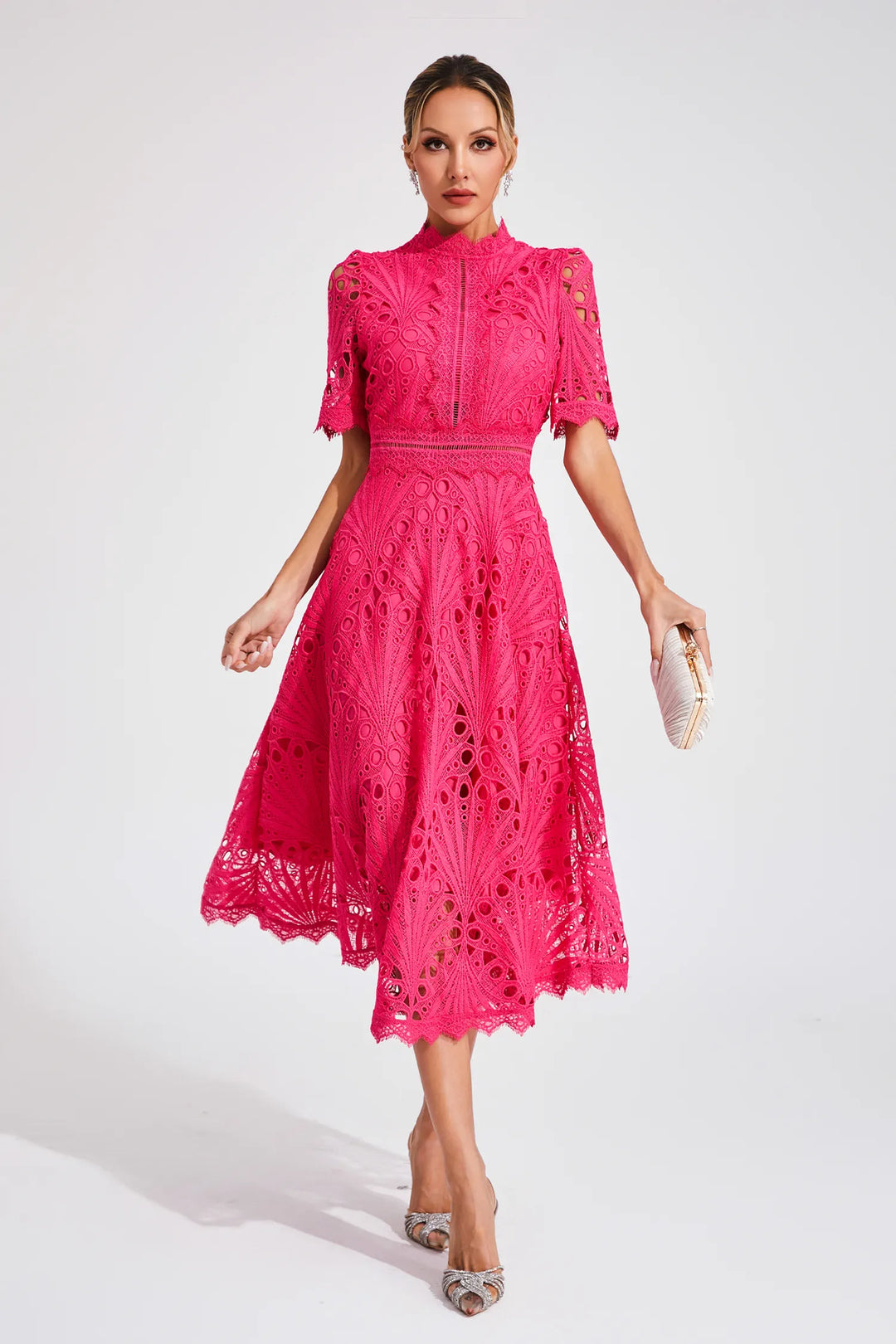 Women's elegant lace party dress in midi length. Feminine style for special occasion outfits.