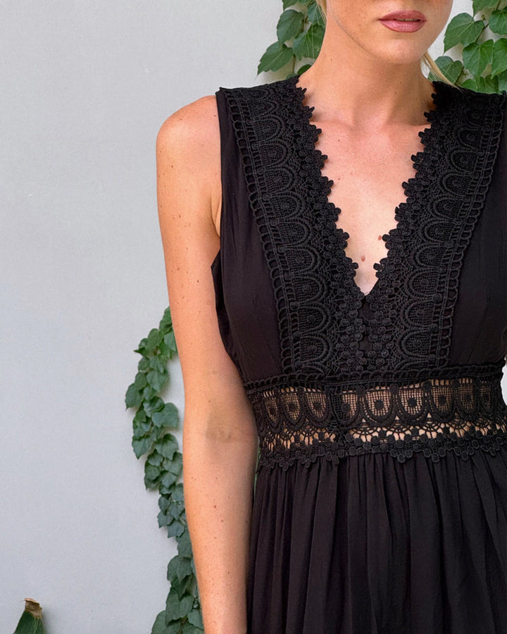 Women's versatile lace midi dress, featuring a V-neck and sleeveless design, suitable for formal or casual wear.