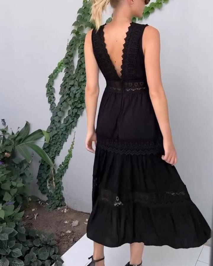 Intricate lace detail on a women's V-neck sleeveless midi dress, showcasing exquisite craftsmanship.