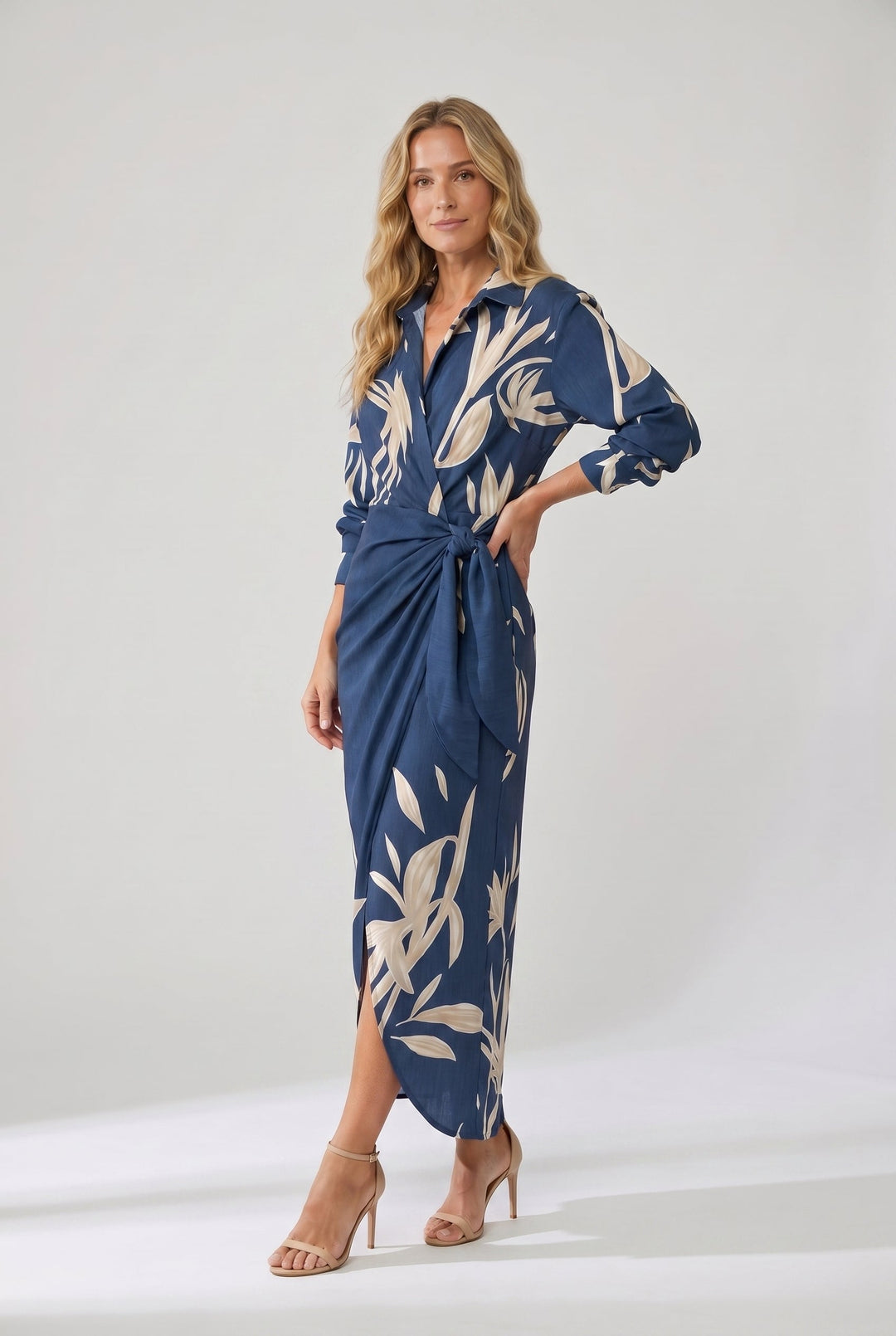 Chic women's elegant maxi wrap dress with a vibrant leaf print, perfect for spring/summer occasion wear.