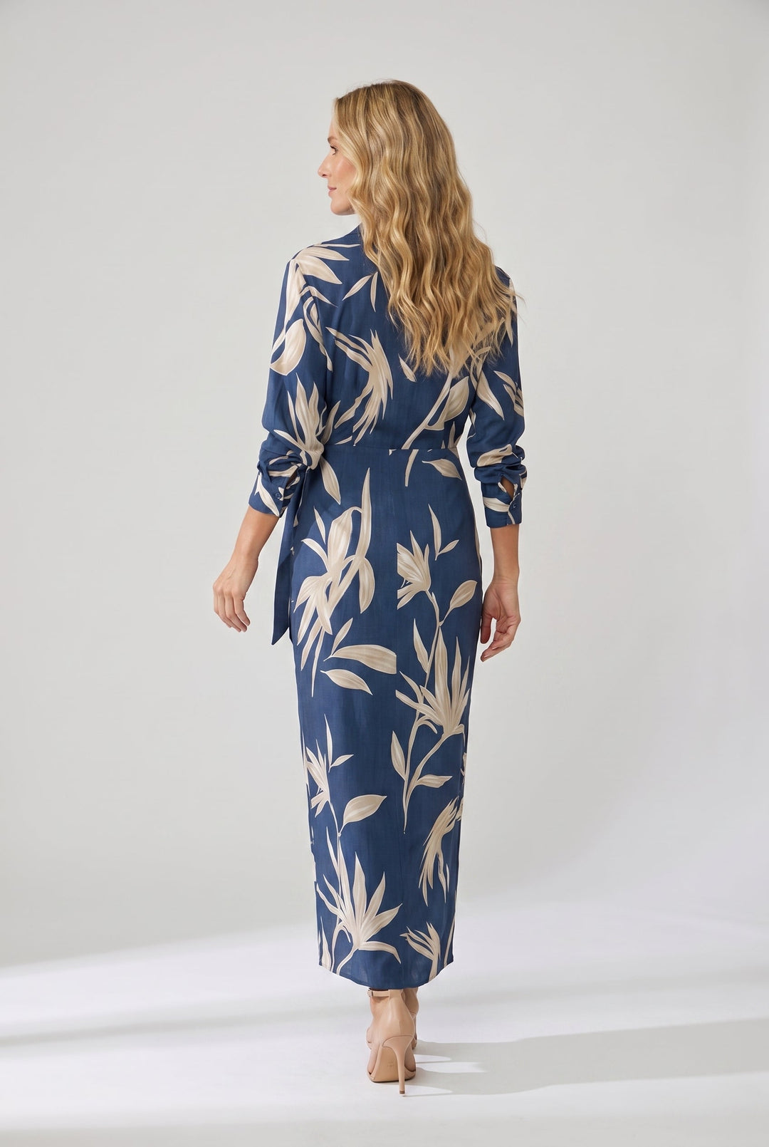 Sophisticated women's leaf print wrap maxi dress, long sleeve design with collared v-neck and side slit.