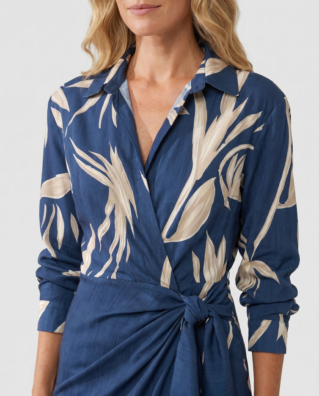 Flowy women's elegant leaf print maxi dress, wrap style with flattering side slit, ideal for summer.
