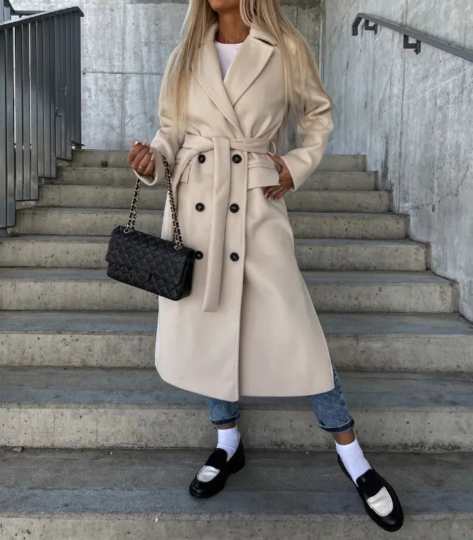 Elegant women's long belted trench coat, tailored for office wear & fall fashion. Classic & chic outerwear.