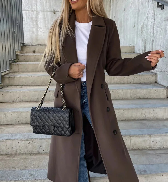 Classic women's belted long coat, ideal for sophisticated office wear or chic fall & winter fashion. Tailored fit.