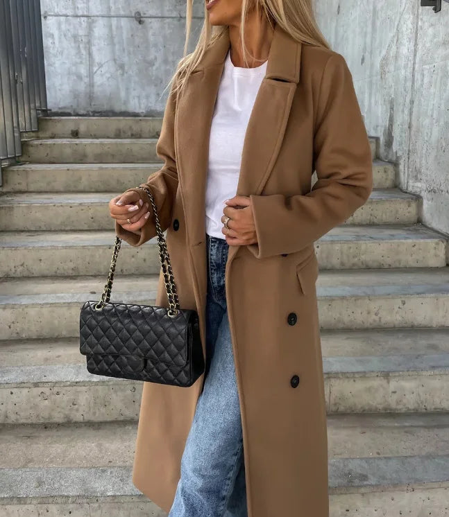 Structured women's long belted trench coat, a tailored office wear staple for elegant fall & winter style.