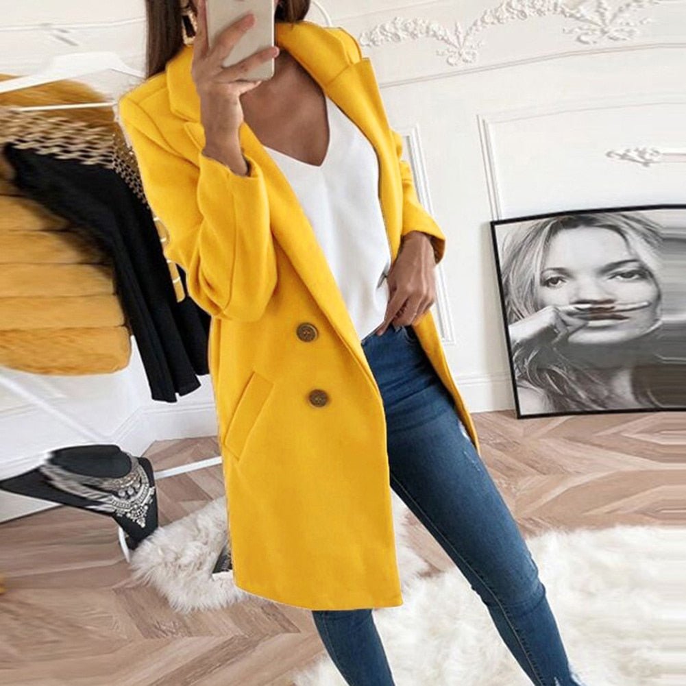 Modern women's long blazer coat, a versatile layering piece. Elegant outerwear for sophisticated professional wear.