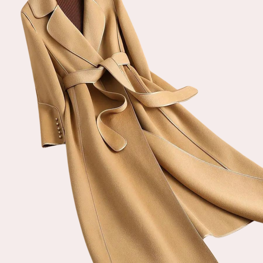 Tailored women's long coat, side view, showing double button detail & a flattering belted silhouette for fall outerwear.