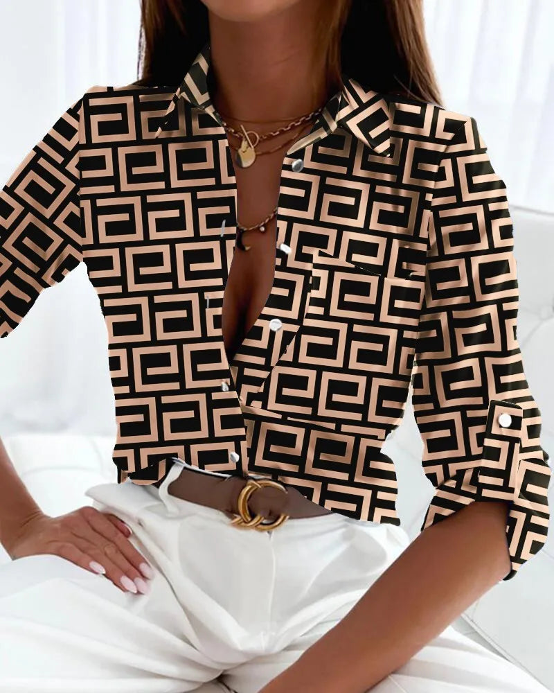 Chic women's long-sleeve blouse featuring an artistic abstract geometric print, an elegant and stylish top.